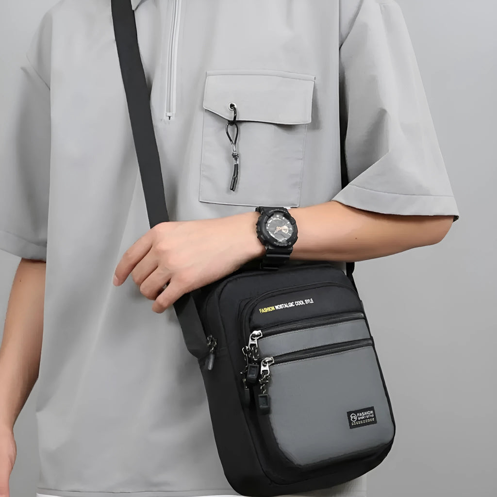 Men's nylon crossbody bag in a solid colour with a shoulder strap, showing urban simplicity style.