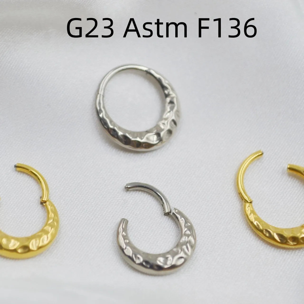 Titanium alloy concave-convex nose ring in gold or silver finish with 1.2mm thickness and 8mm or 10mm diameter options