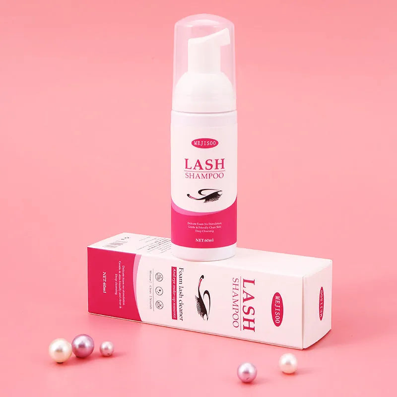 60ml bottle of Lash Shampoo Mousse eyelash cleaning solution on a beauty background.