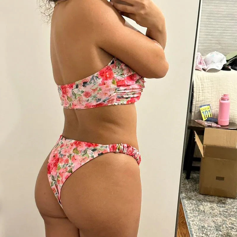 Floral printed lace bikini top in blue, shown as a sleeveless, backless tube top for swimming.