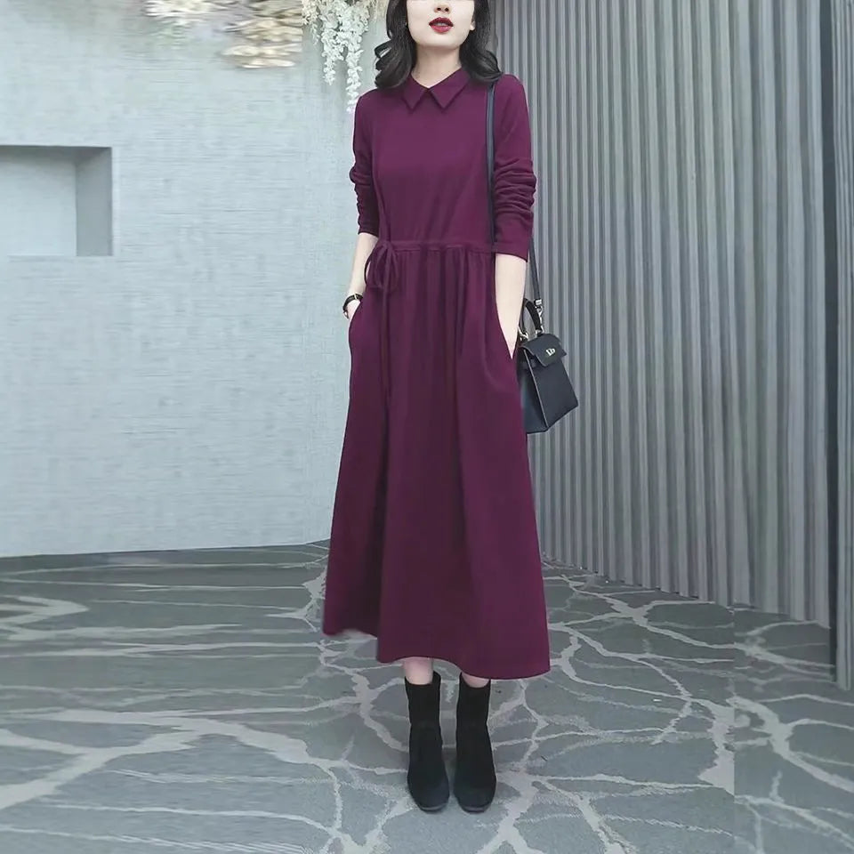 Purplish red long-sleeve maxi dress on a model, showing full-length 130-140cm skirt and urban style tailoring.