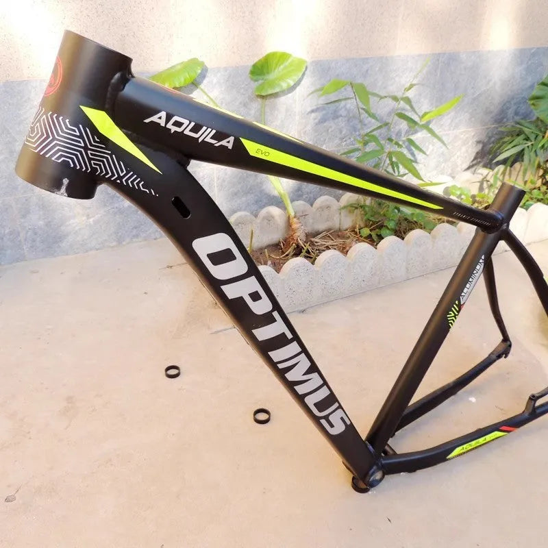 29-inch black green aluminium mountain bike frame showing inner cable routing ports and disc brake mount
