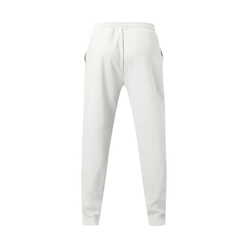 Men's loose straight trousers in waffle polyester with drawstring, available in multiple colours including black and light grey