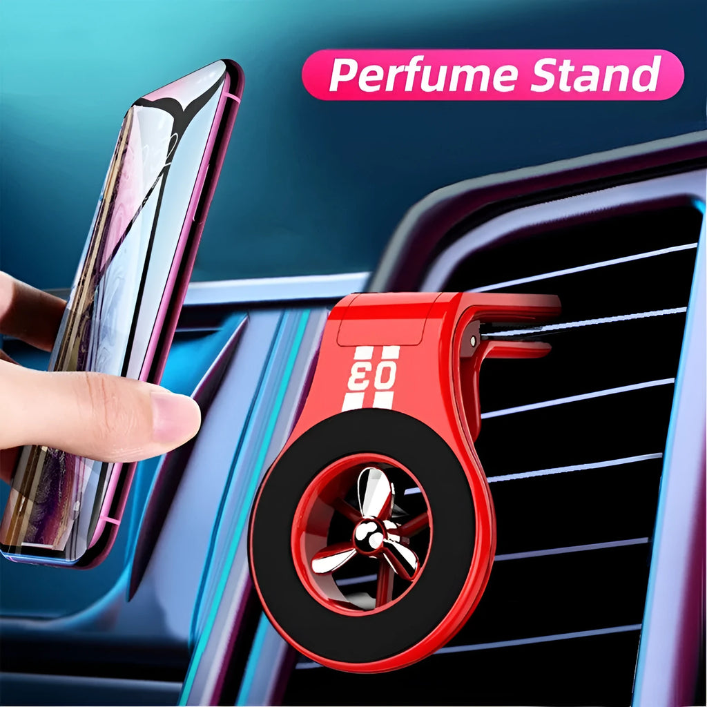 Black magnetic car phone holder clipped to a car air vent, showing a smartphone attached and the 360-degree rotating bracket.