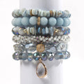 Women's glass beaded stretch bracelet set in brown with natural stone and zircon beads on a white surface