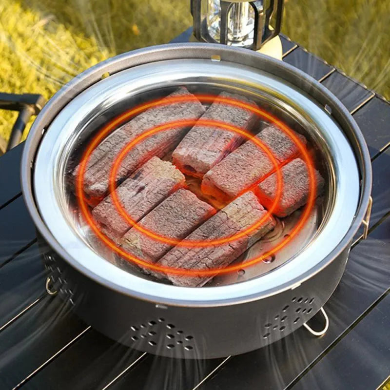 Portable stainless steel barbecue grill with detachable parts and storage bag for camping.
