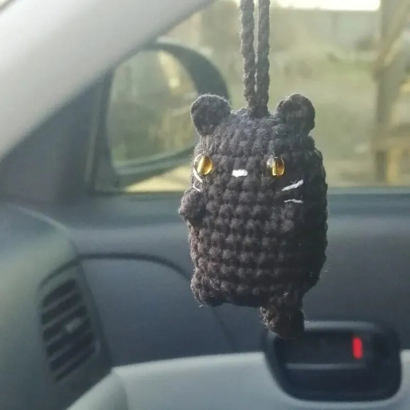 Plush hand-woven car hanging ornament in a cartoon design, made from soft polyester fabric.