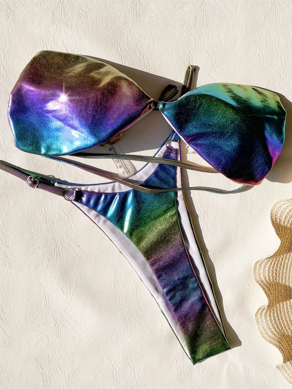 Women's purple gradient two-piece bikini swimsuit set on a mannequin.