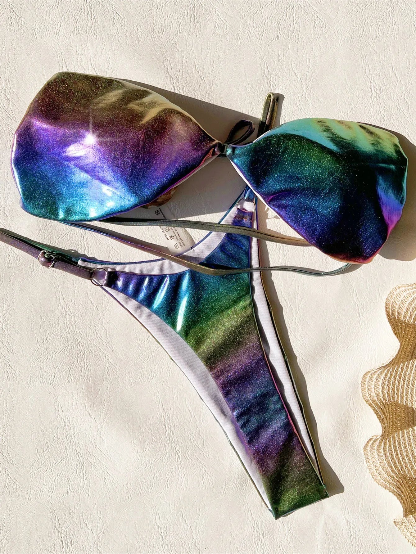 Women's purple gradient two-piece bikini swimsuit set on a mannequin.