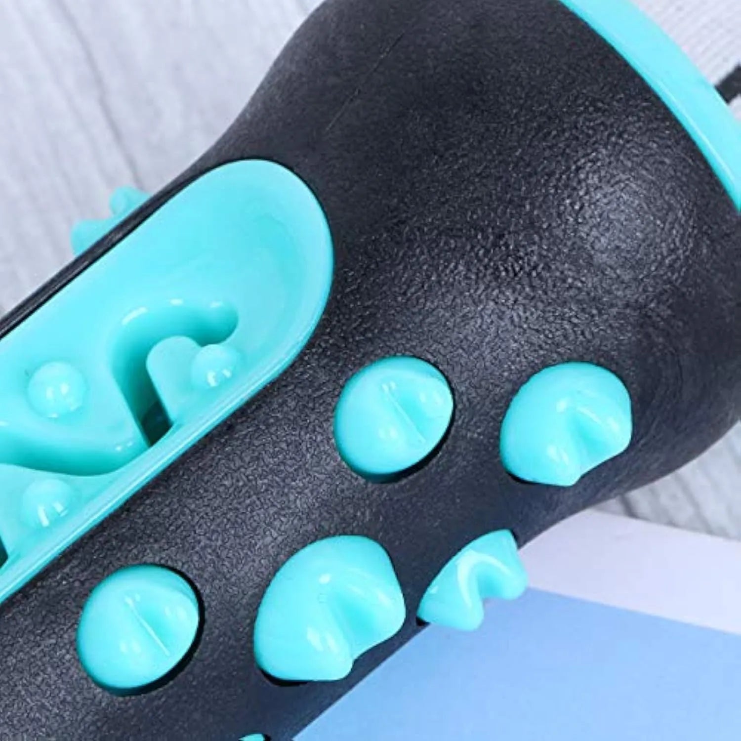 Natural rubber dog dental chew toy in blue with toothbrush texture for cleaning teeth.