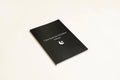 Black cover Dream Journal notebook with business simplicity styling, open on a page.