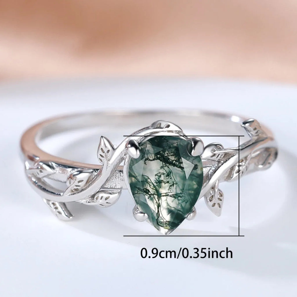S925 silver ring with drop-shaped natural agate stone and branch leaf edge design on white background