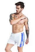 Men's blue slim-fit sports shorts with lace-up detail and integrated padding