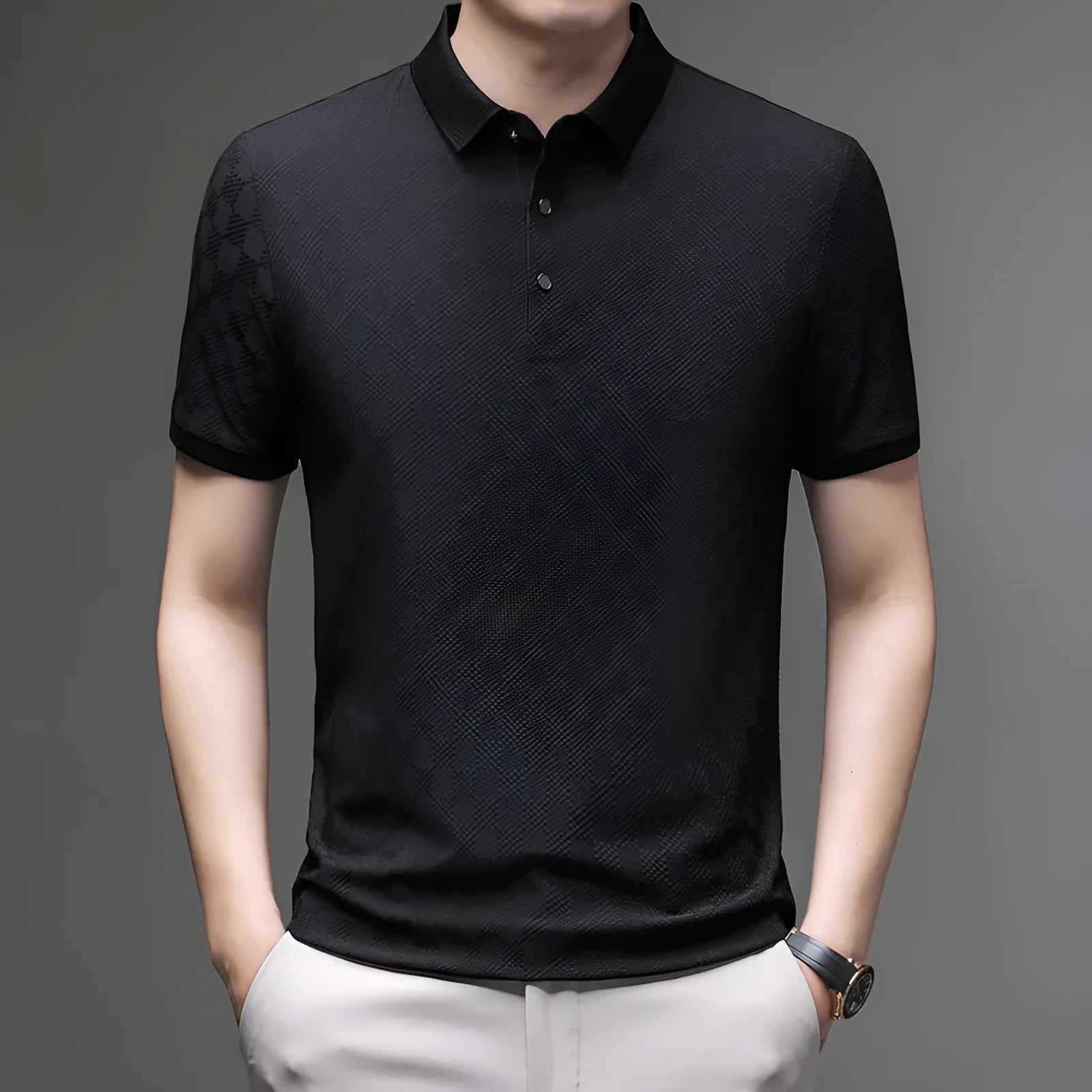 Man wearing a thin black V-neck t-shirt with a rhombus pattern and a side slit detail on the hem.