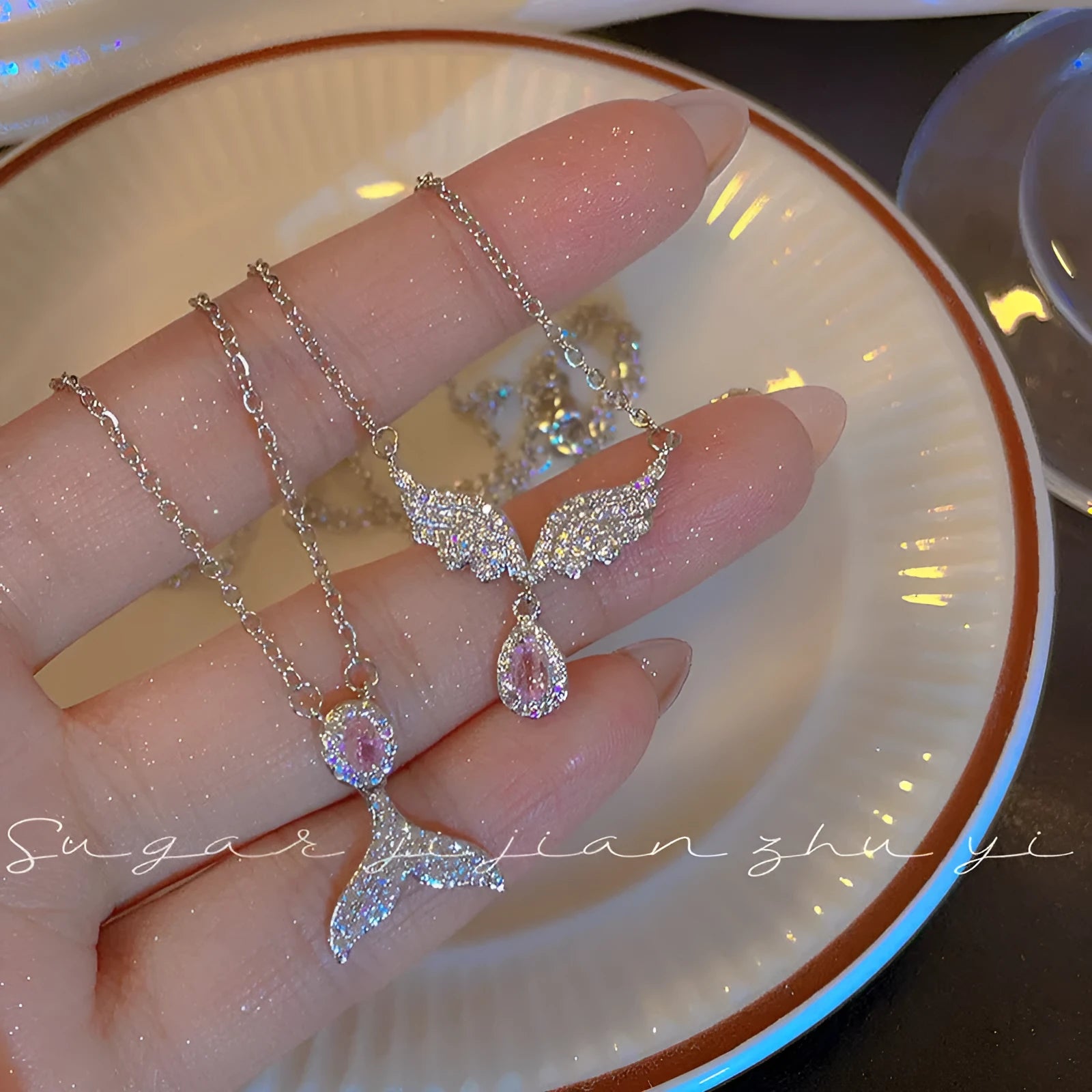 Women's S925 sterling silver adjustable necklace with choice of angel wing or fishtail pendant on O-ring chain