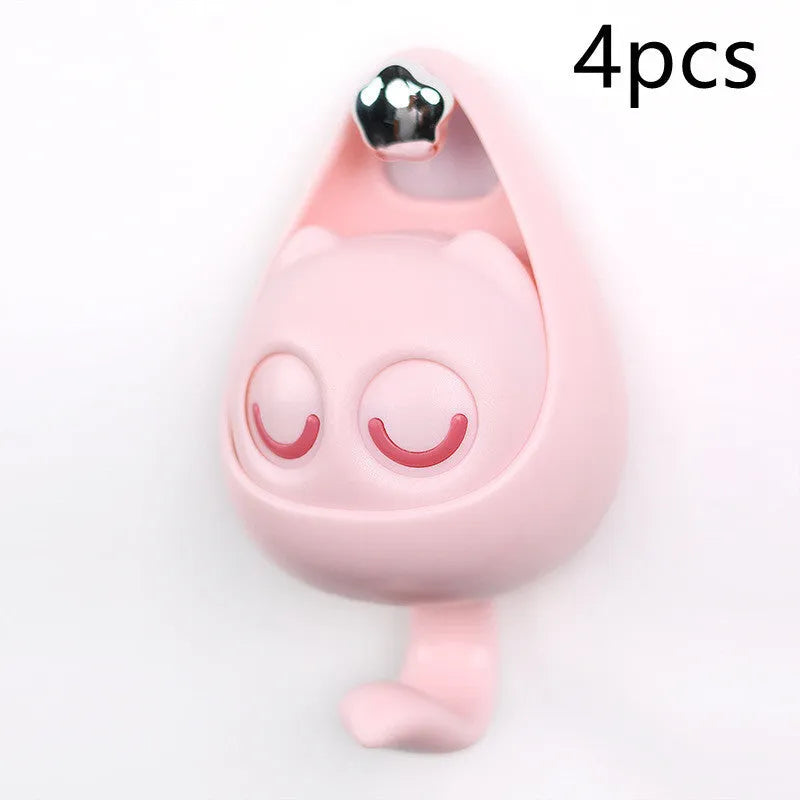 Cream white cat-shaped adhesive wall hook with winking eyes, 2.5kg capacity, 105x61x45mm