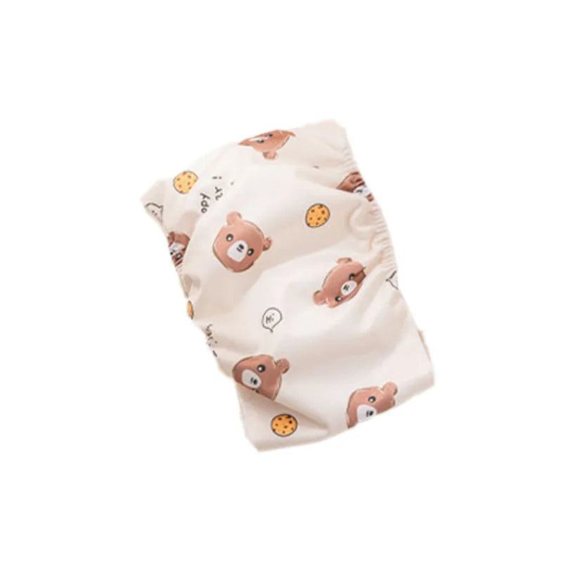 Reusable cartoon bone print dog diaper with fastener tape and elastic waistband, shown in blue bear pattern.