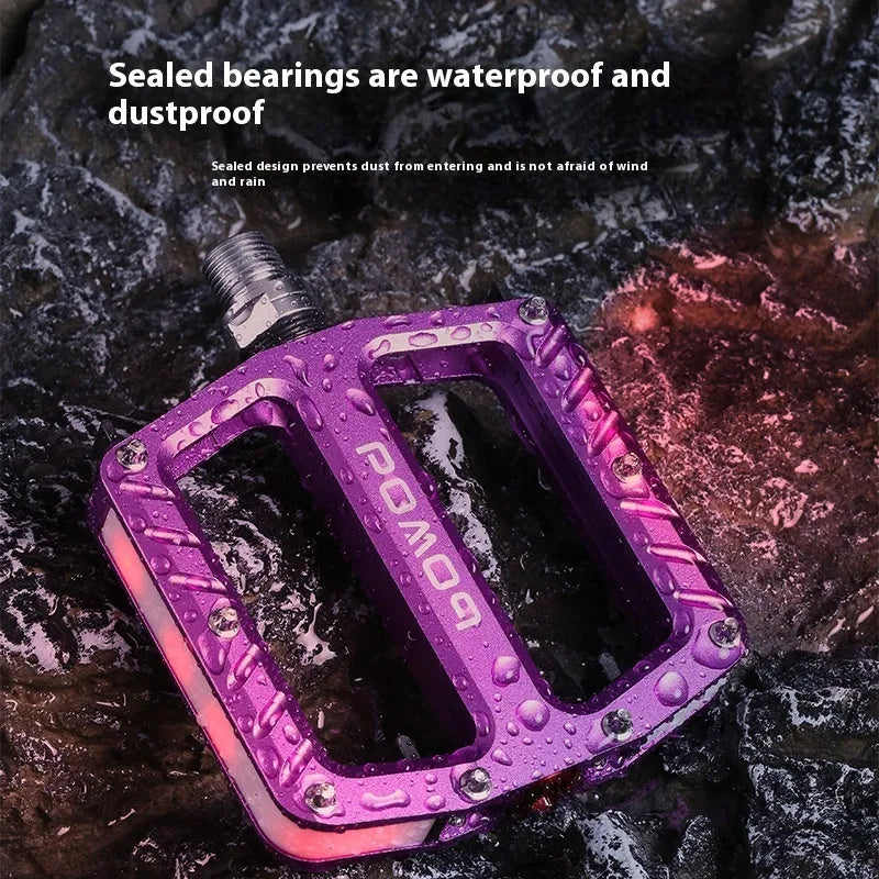 Bicycle pedal with LED lights in aluminium alloy construction, showing multiple colour options