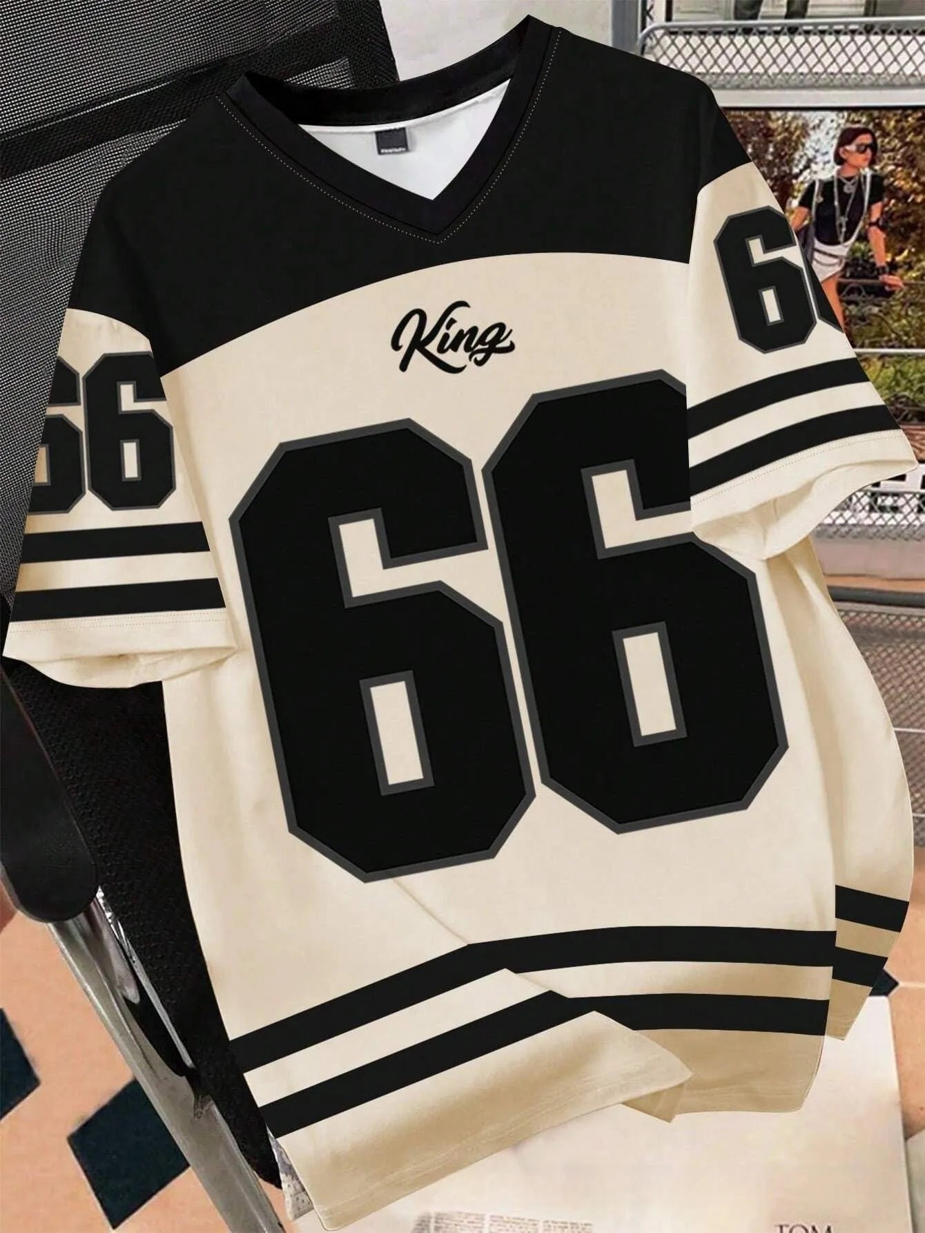 Man wearing a loose grey t-shirt with a large Chicago No. 23 digital print on the front.