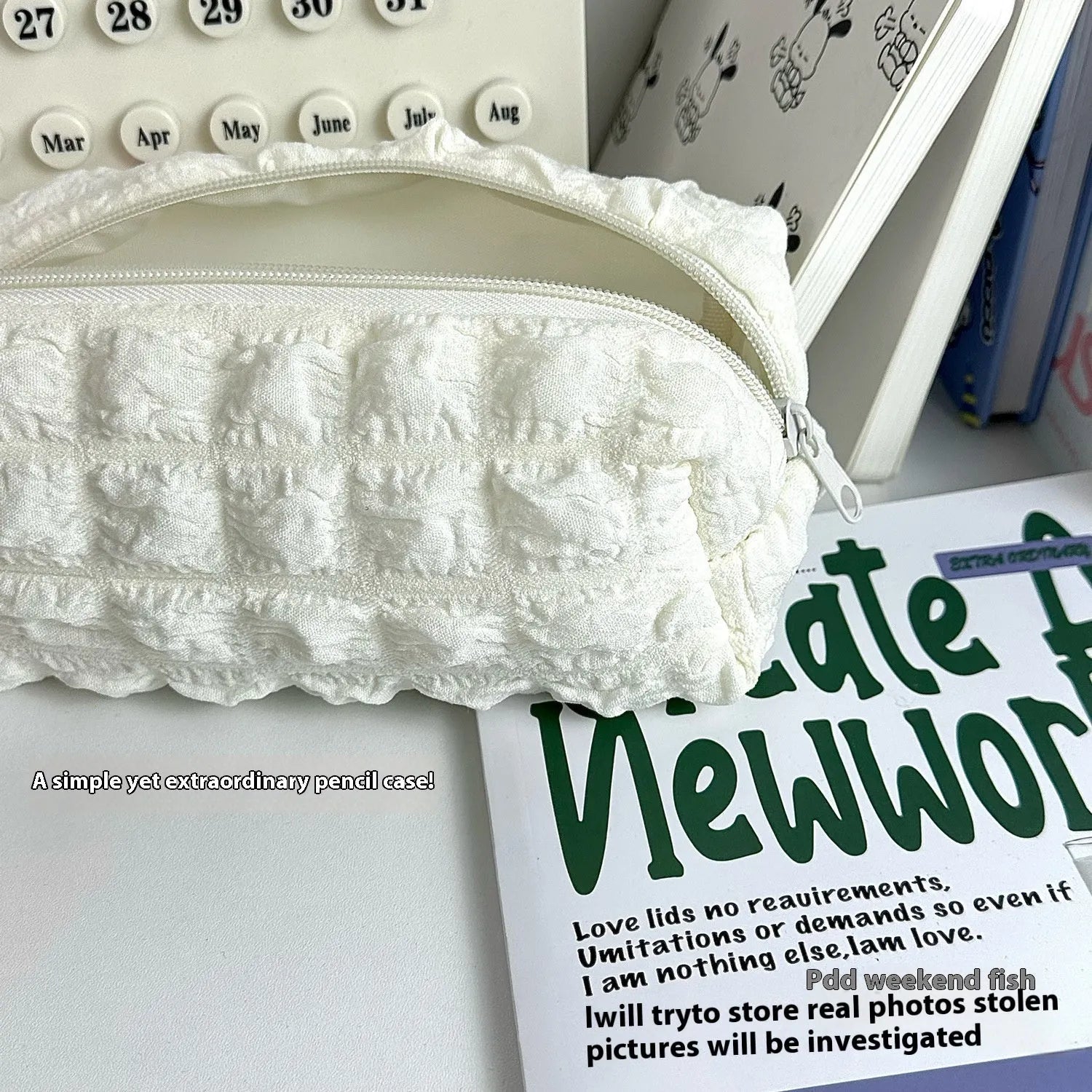 Beige fabric pencil case with a soft, rounded cream puff design and a zipper.