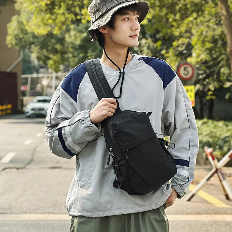 Multi-functional waterproof nylon backpack in black, free size, with curved shoulder strap and visible sewing thread detailing