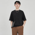 Men's loose drape knit short-sleeve T-shirt in solid brown, white or black, polyester blend, sizes S to 2XL