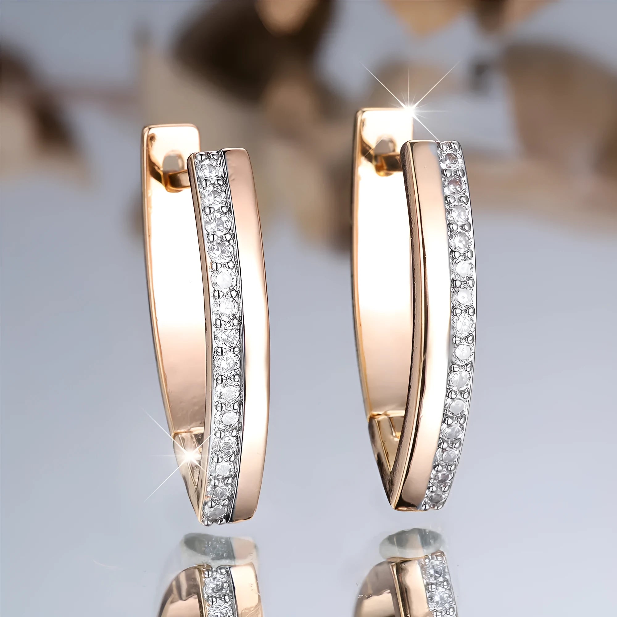 Women's V-shaped geometric ear clips, copper with electroplated champagne gold finish, clip-on style