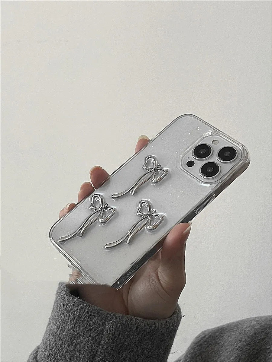 Metal bow iPhone case with anti-drop function and 3D epoxy drip glue detail, available for iPhone 15, 14, 13, 12, and 11 models.