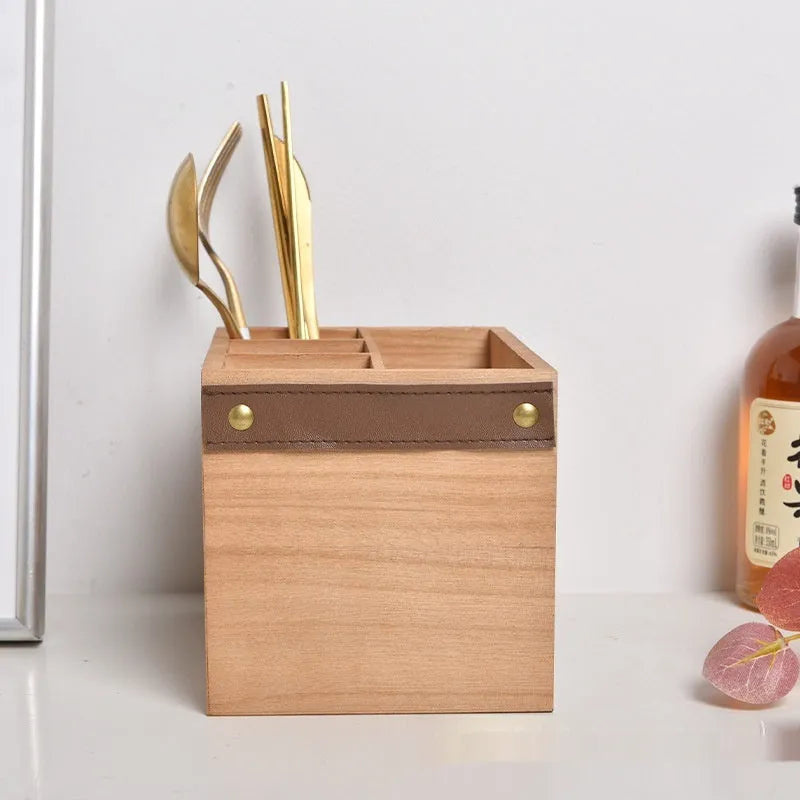 Modern solid-colour wooden kitchen storage box for knives, forks, and chopsticks with an internal grid.