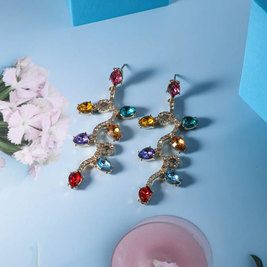 Retro fashion small lantern zircon stud earrings in colourful alloy on white background
