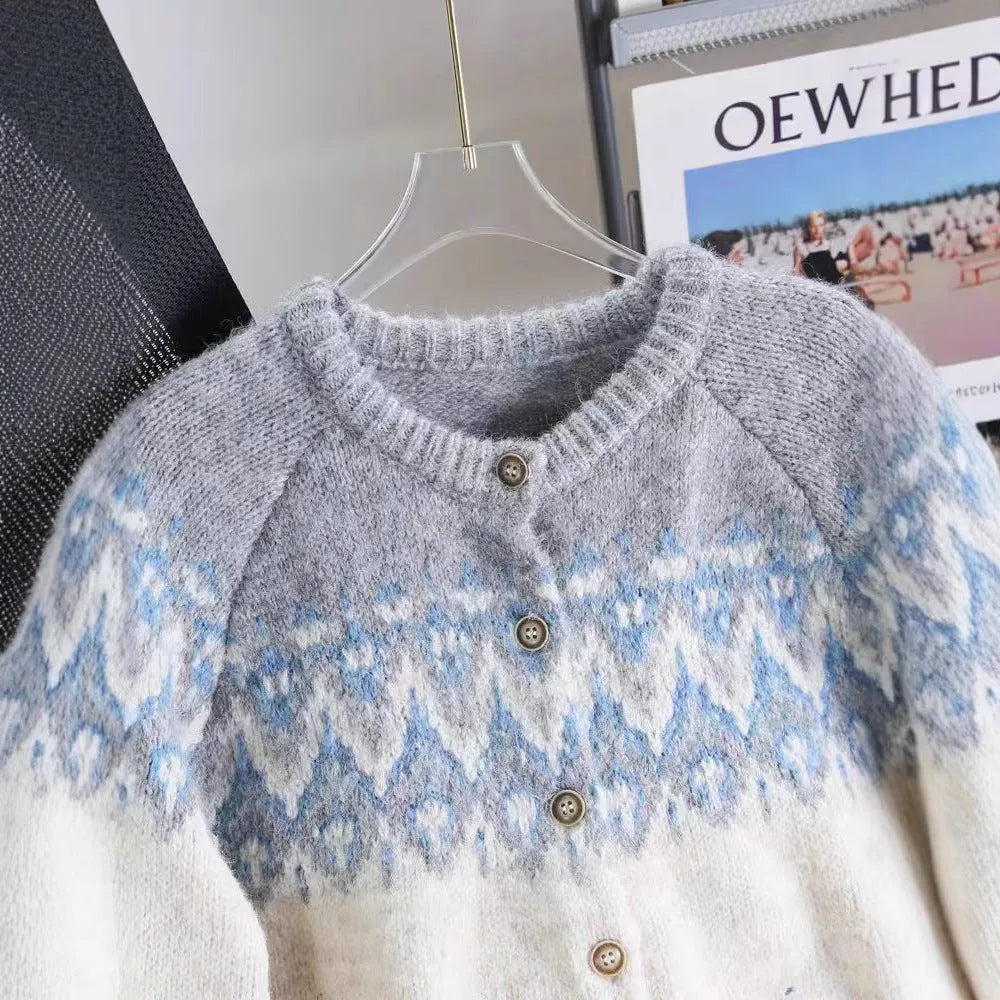 Women's beige jacquard knit sweater coat with loose fit and long sleeves.