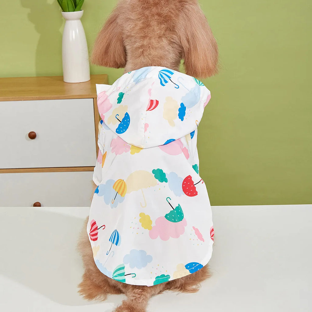 Colourful cartoon umbrella pattern dog raincoat sized L on a golden retriever.