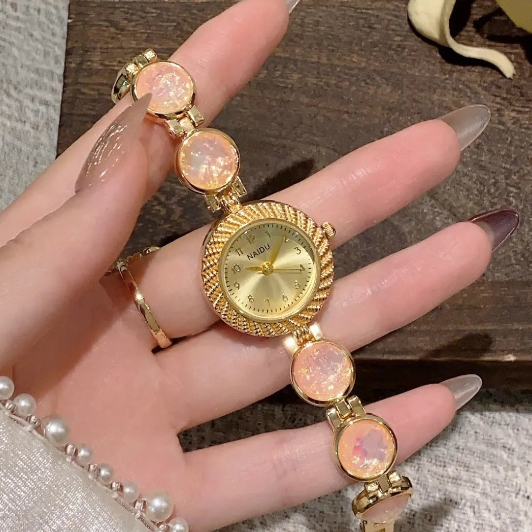 Women's quartz watch with round 25mm dial in one of six colour options on a wrist