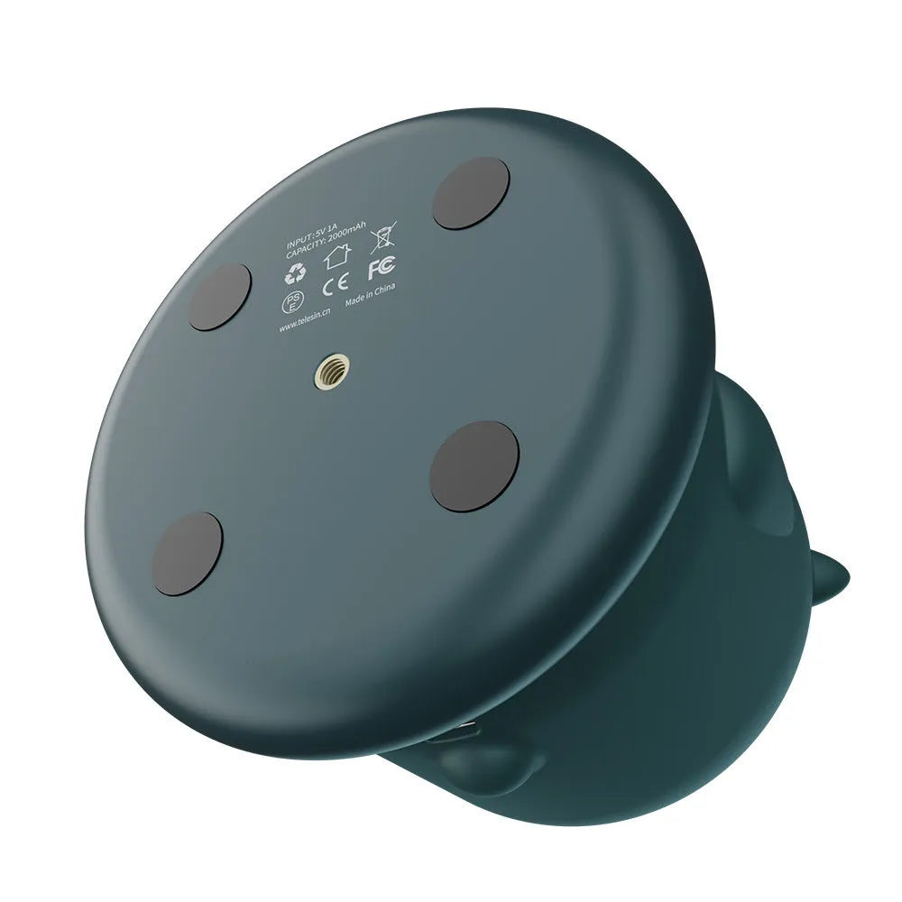 Dark green intelligent AI face recognition gimbal with 360-degree rotation on a desk.