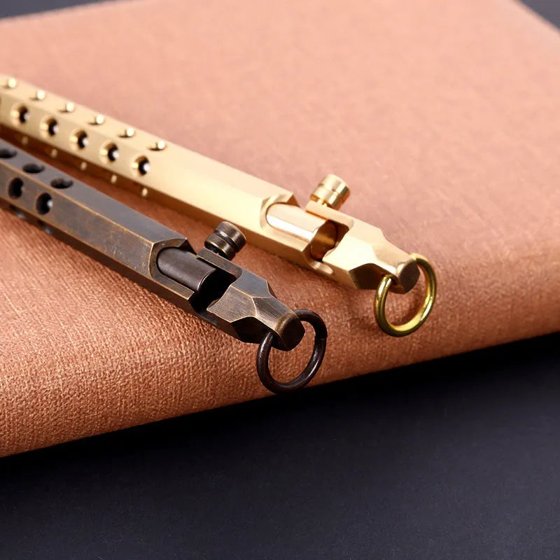 Brass hexagonal bolt action rollerball pen showing six-angle barrel and bolt mechanism