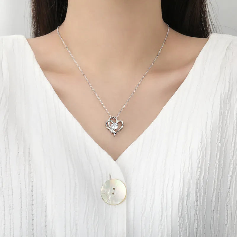 Heart-shaped women's necklace in 925 silver with diamond treatment, showing three colour options