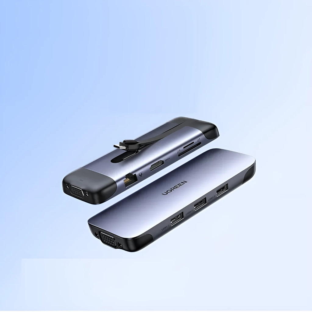 Silver USB laptop docking station with HDMI, USB 3.0, and charging ports on a desk.