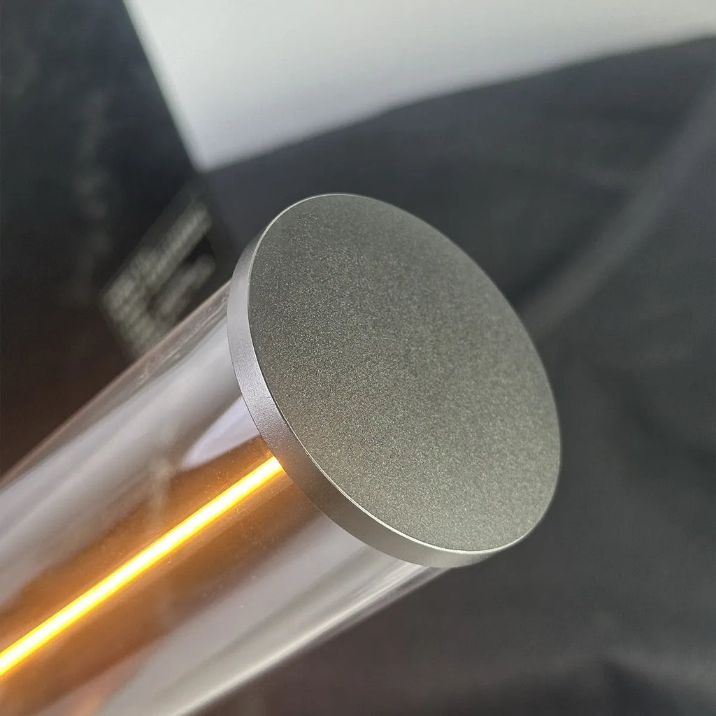 Slim modern glass LED bar night light with magnetic base on a desk surface.