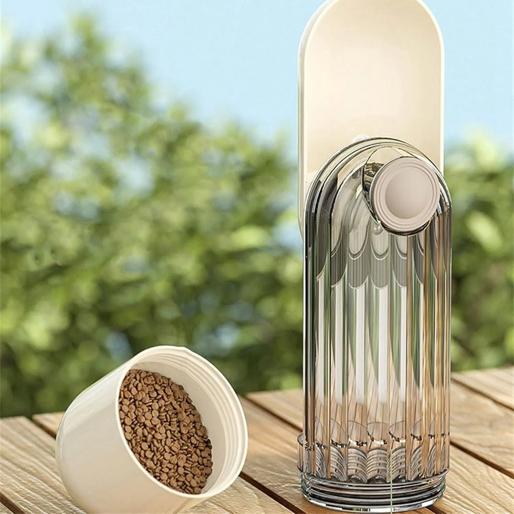 Beige and green foldable dog water bottle with food container, showing scale next to a dog's muzzle.