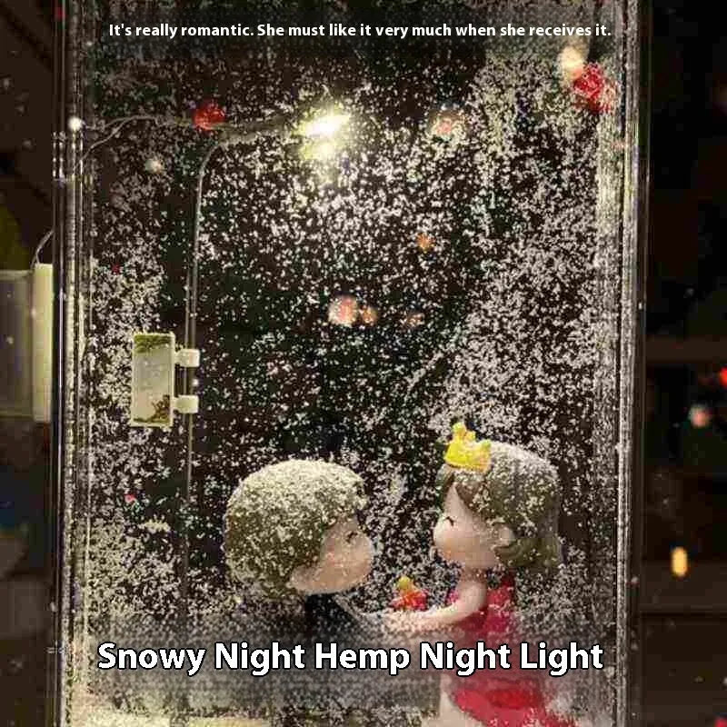 Assembled DIY snowy landscape night light with small street light and warm LED glow on a desktop.
