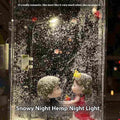 Assembled DIY snowy landscape night light with small street light and warm LED glow on a desktop.