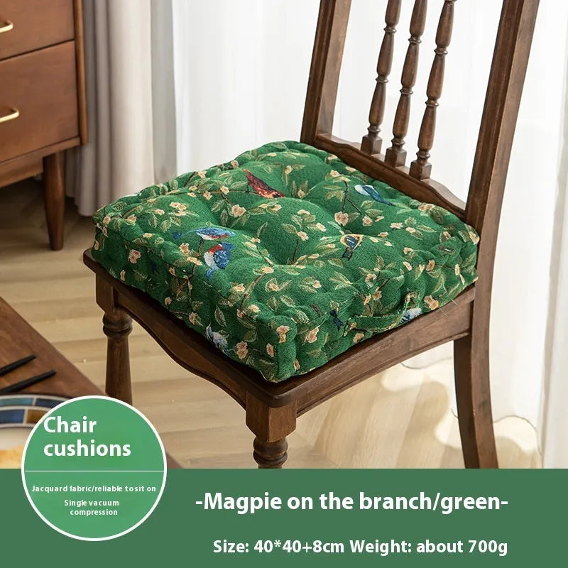 American-style square dining chair cushion with thick padding and botanical print.