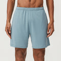Men's sky blue double-layer running shorts with mid-waist fit and inner lining laid flat.