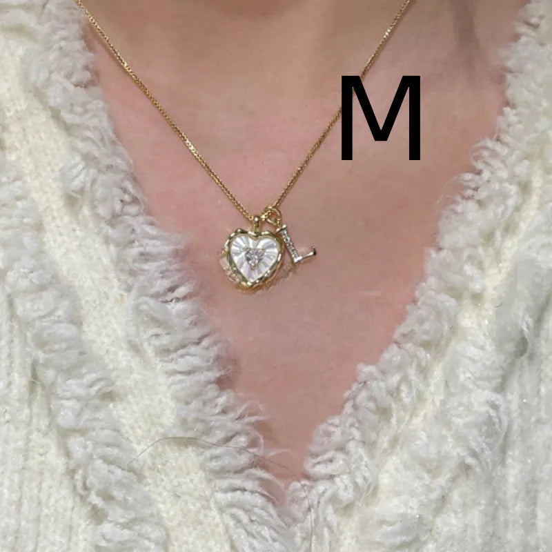Women's pendant necklace with titanium steel chain and natural mother-of-pearl in heart-shaped design