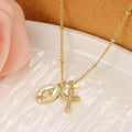 Geometric Virgin Mary cross pendant on a 45cm gold-coloured chain with an adjustable lobster clasp.