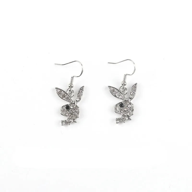 Pair of rabbit-shaped stud earrings with diamond accents on a silver background, showing front and back with butterfly clutch.