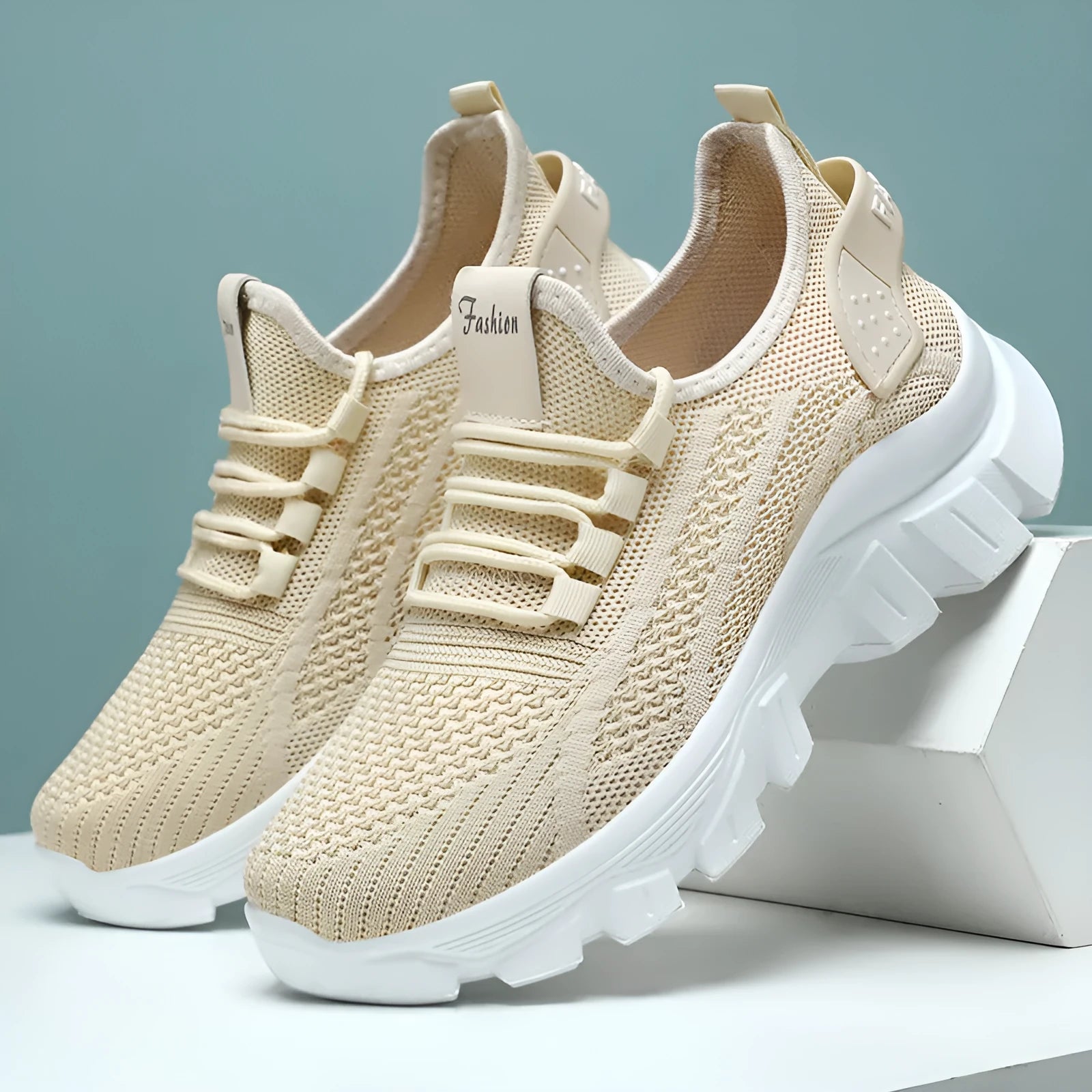 Women's white Flyknit running sneakers with a round toe and flat PVC sole, shown with lace-up front.