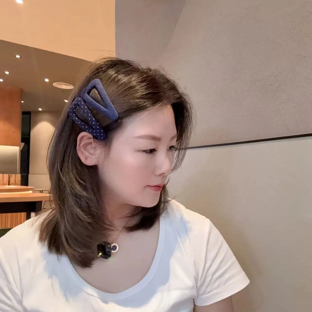 Retro style hair barrettes in dark denim and polka dot patterns, showing triangle and water drop shapes.