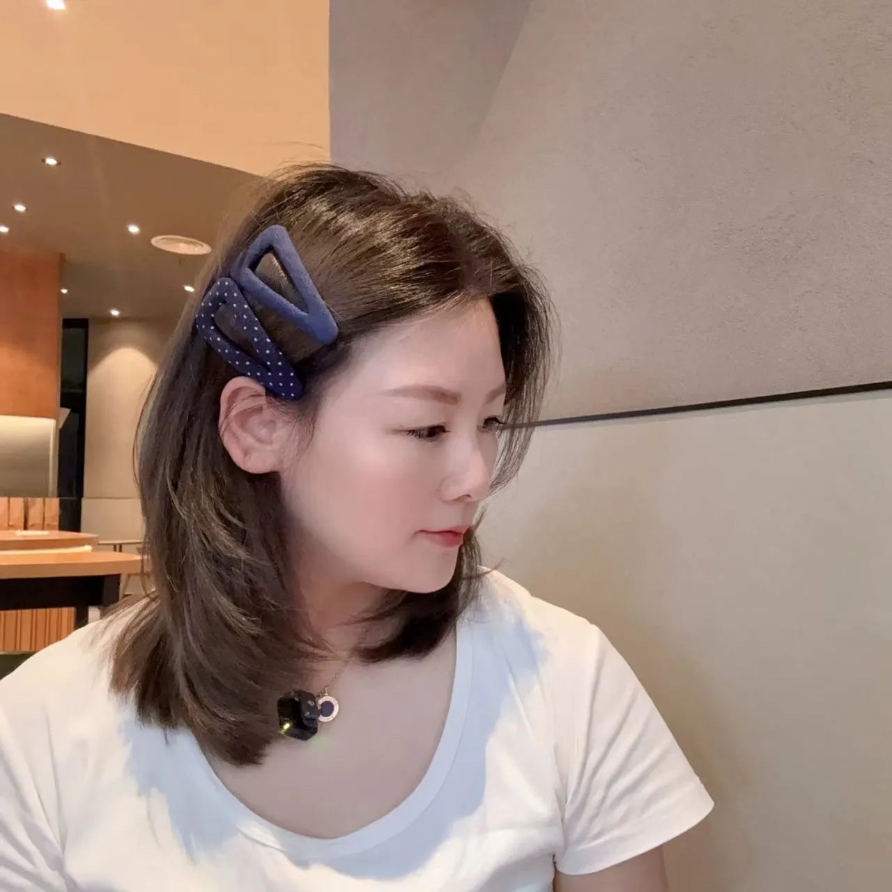 Retro style hair barrettes in dark denim and polka dot patterns, showing triangle and water drop shapes.