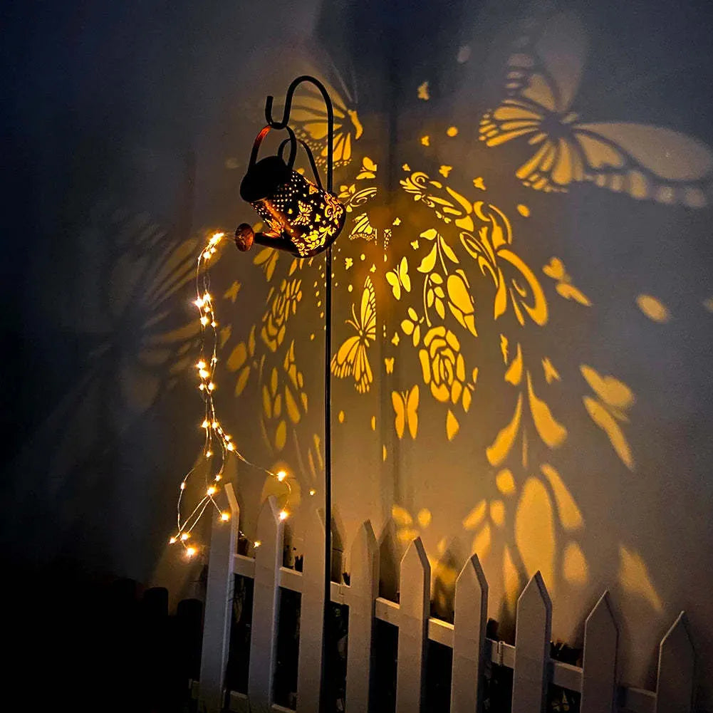 Solar garden lamp with tapered iron butterfly design and warm white LED light.